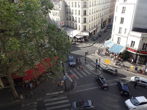 View down from our apartment down to the street. It is very important to have a cafe at every possible corner.